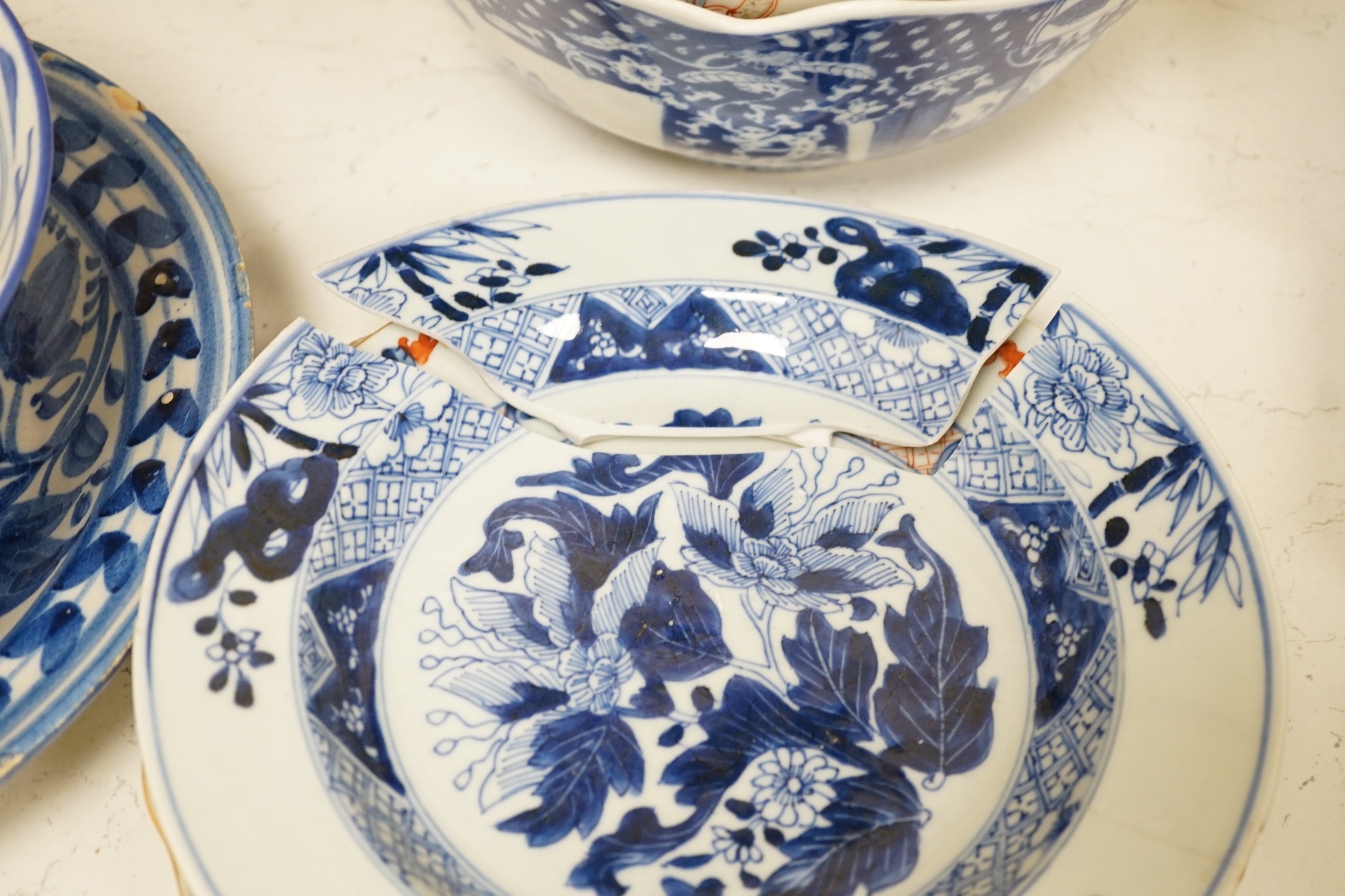 An assortment of 18th century and later Chinese porcelain, a tin-glazed earthenware charger and a Delft vase